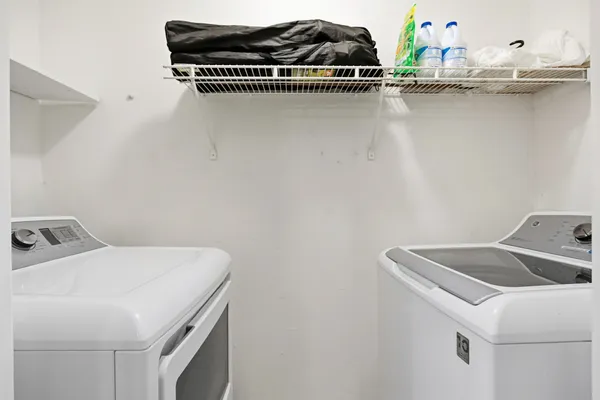 a utility room with dryer and washer