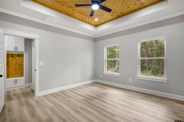 a spacious bathroom with a shower sink and mirror