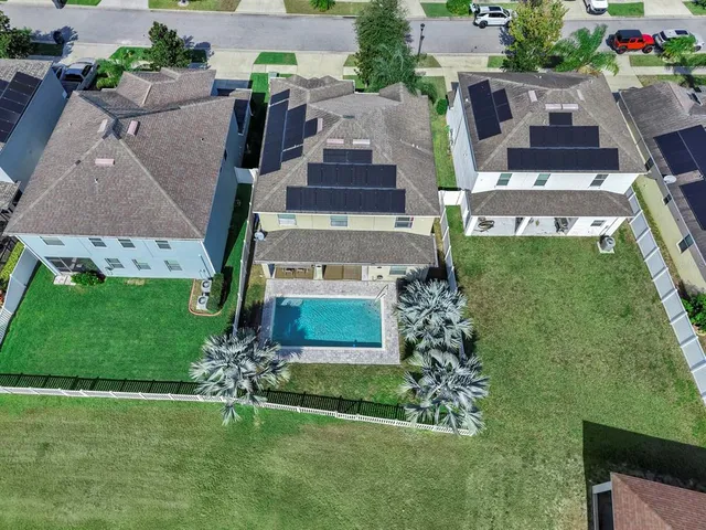 an aerial view of a house with a garden