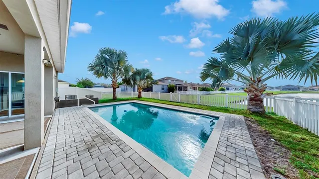 a view of swimming pool with a patio