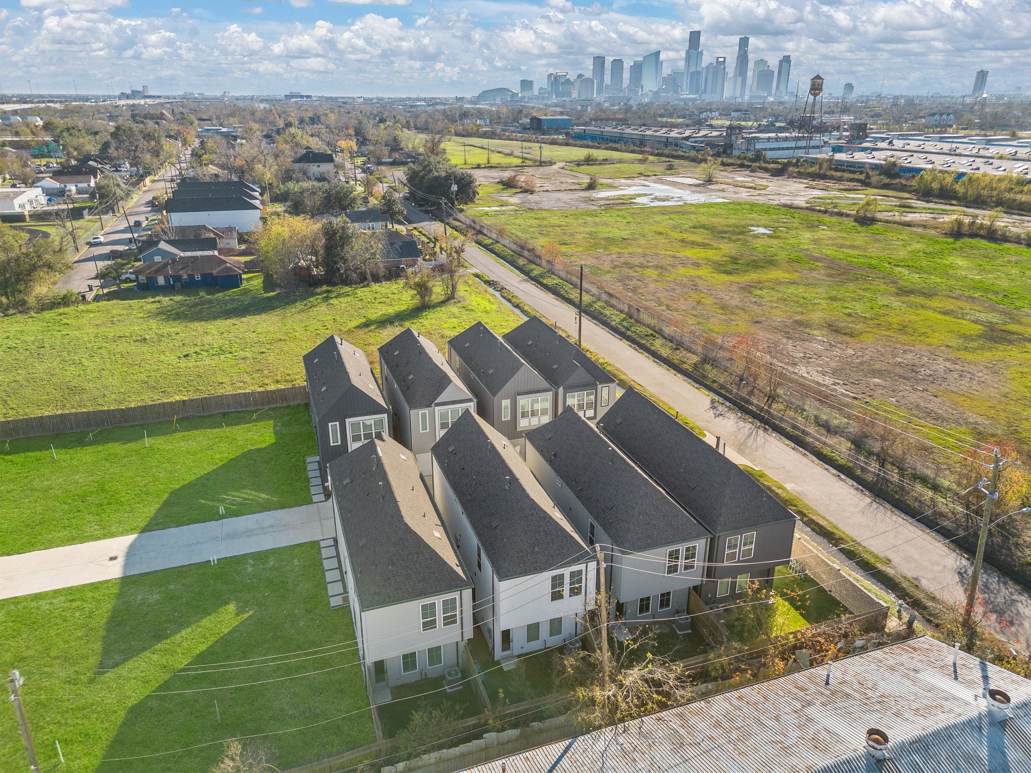 2928 Stevens Street Houston, TX 77026 - Photo 25 of 30 Modern townhomes in a serene setting, offering spacious layouts and ample natural light. Located near a vibrant city skyline, with plenty of open green spaces and easy access to urban amenities.