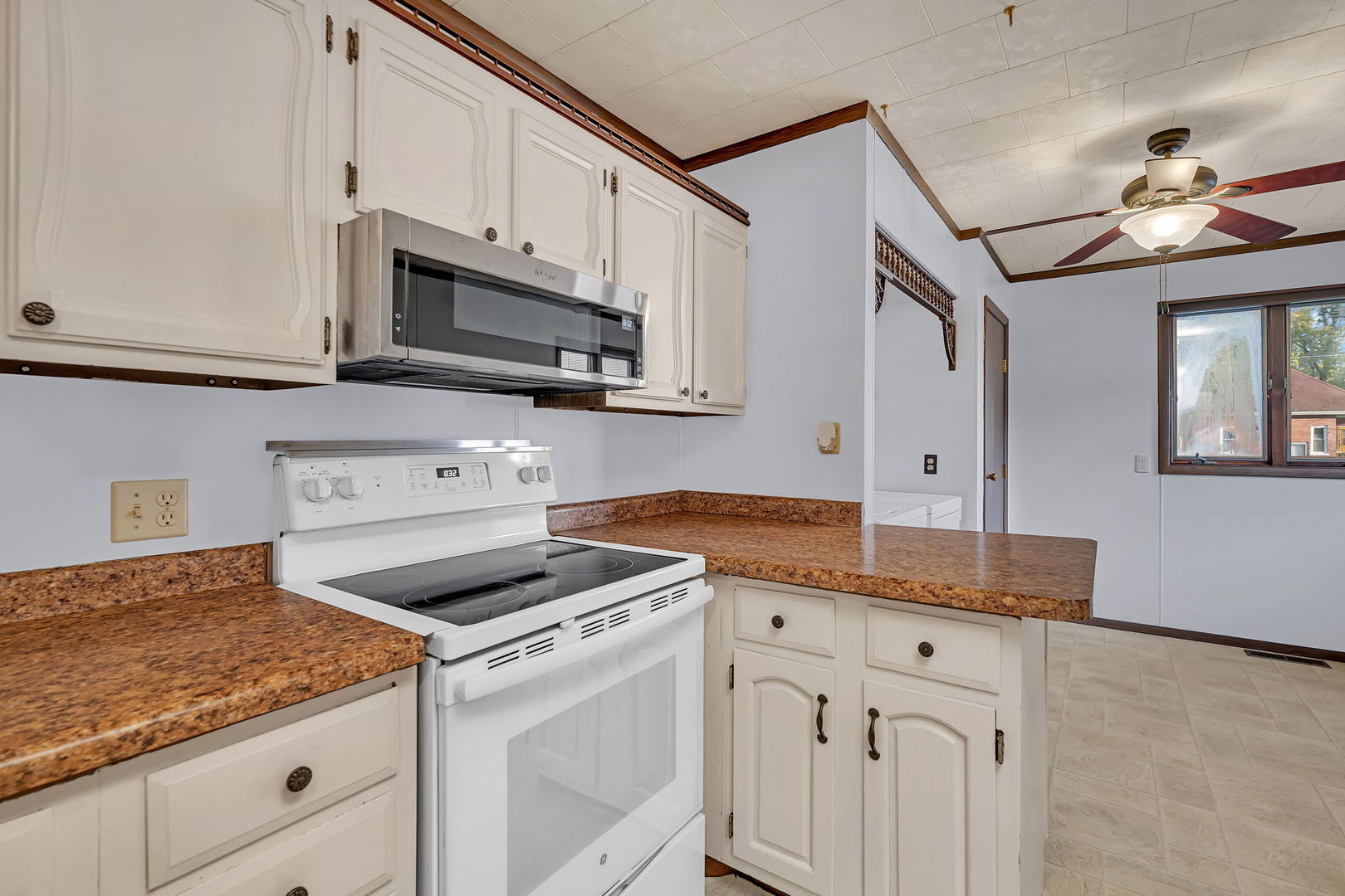 308 East Delaware Street Dwight, IL 60420 - Photo 13 of 29 a kitchen with granite countertop cabinets stainless steel appliances and a counter space
