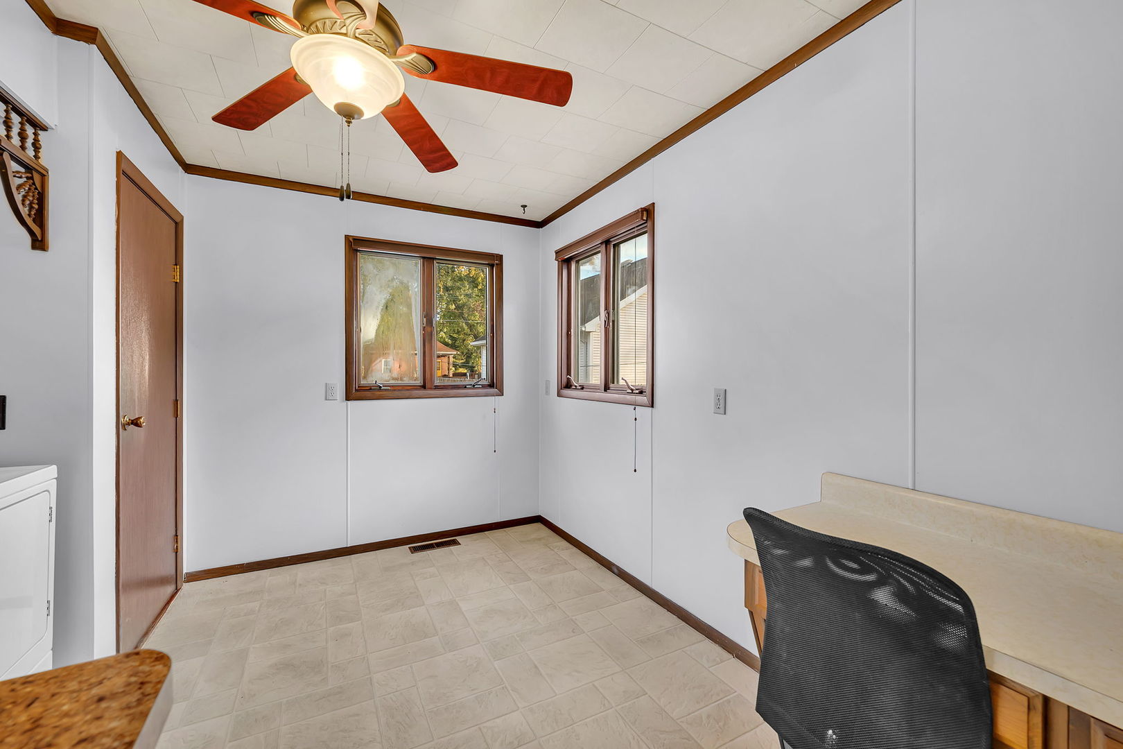 308 East Delaware Street Dwight, IL 60420 - Photo 16 of 29 a view of an empty room with window and a chandelier fan