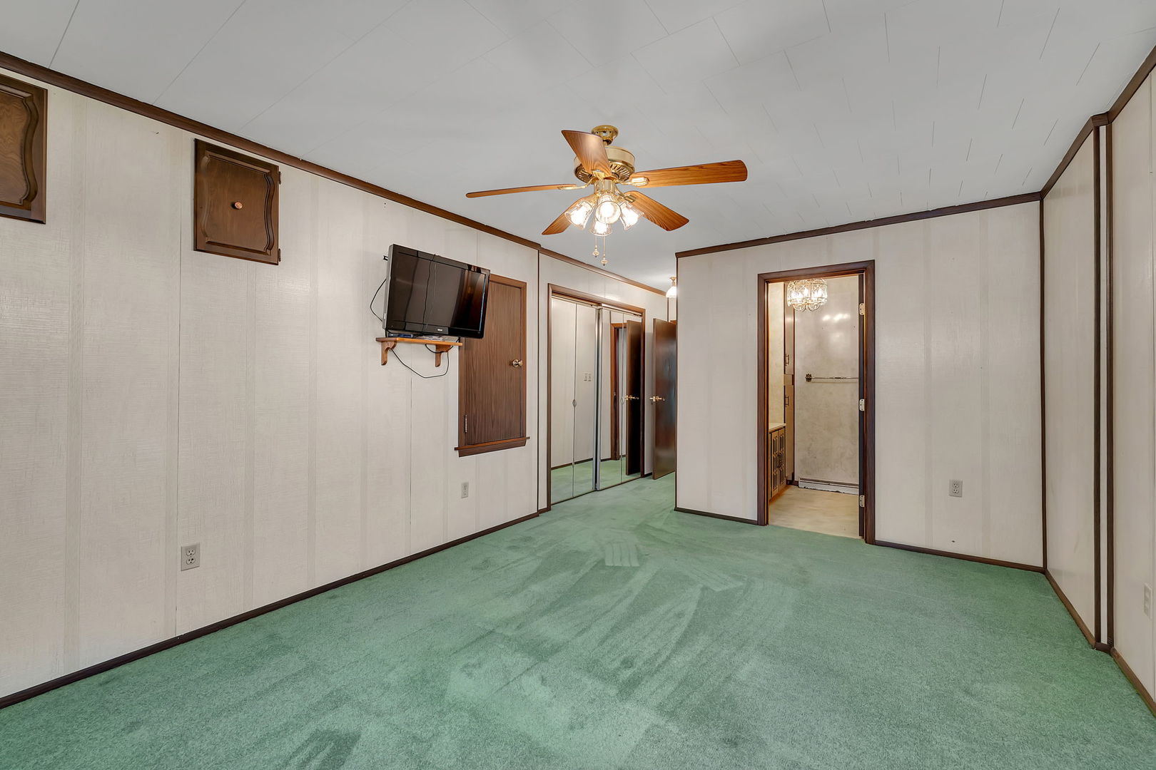308 East Delaware Street Dwight, IL 60420 - Photo 19 of 29 a view of a livingroom with a ceiling fan and window