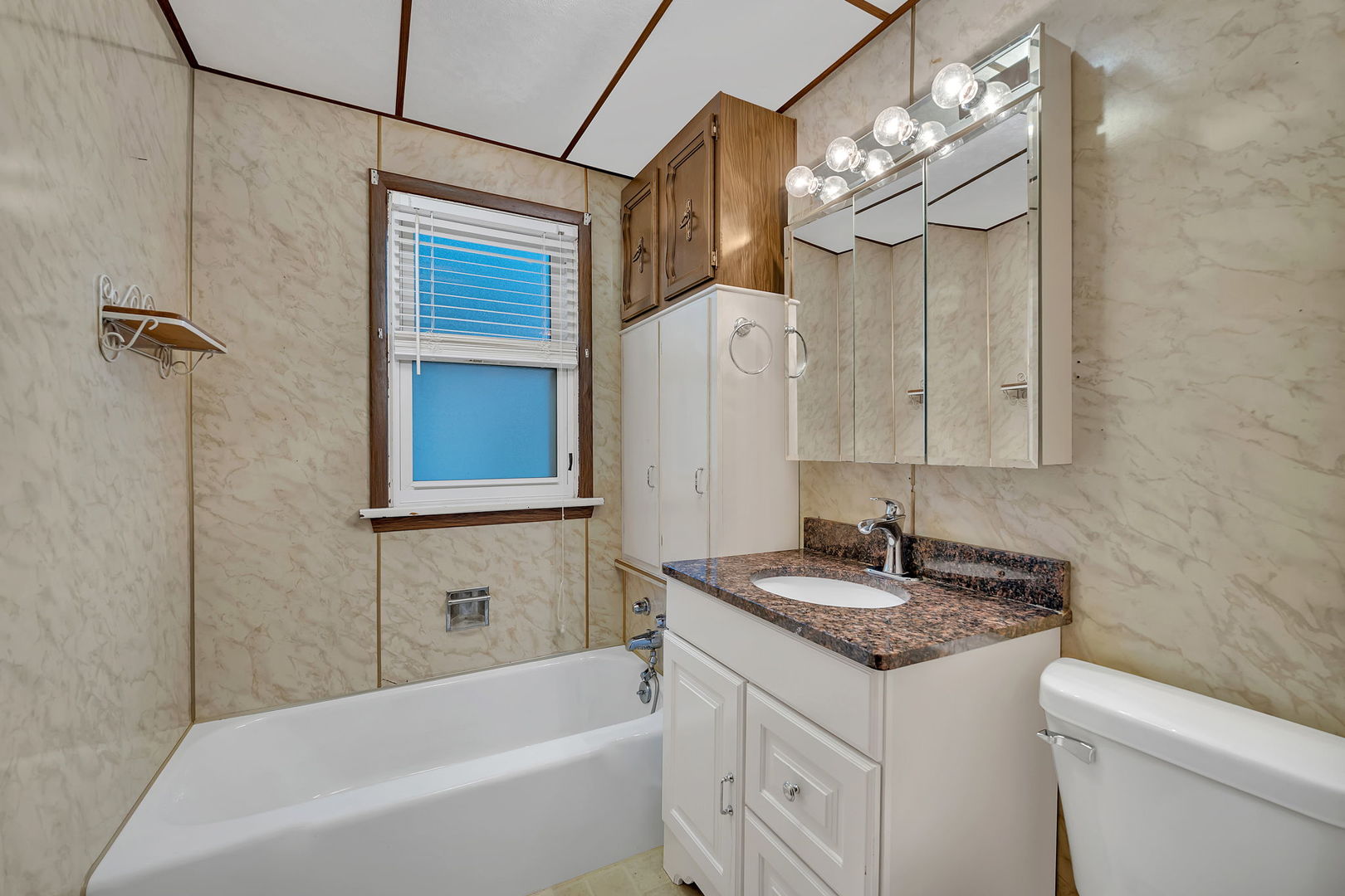 308 East Delaware Street Dwight, IL 60420 - Photo 22 of 29 a bathroom with a granite countertop sink and a mirror
