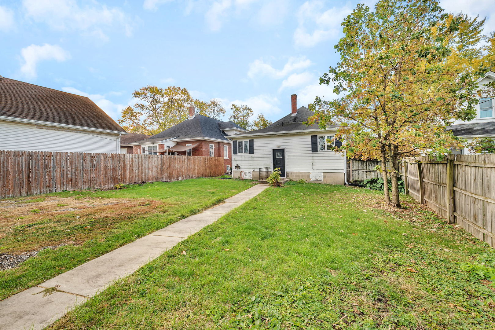 308 East Delaware Street Dwight, IL 60420 - Photo 29 of 29 a view of a house with a big yard and large tree