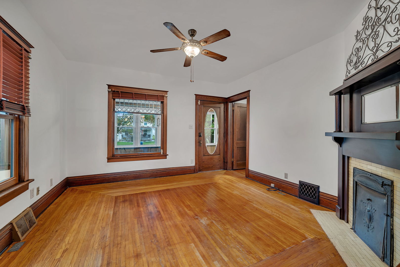 308 East Delaware Street Dwight, IL 60420 - Photo 7 of 29 a view of an empty room with window and wooden floor