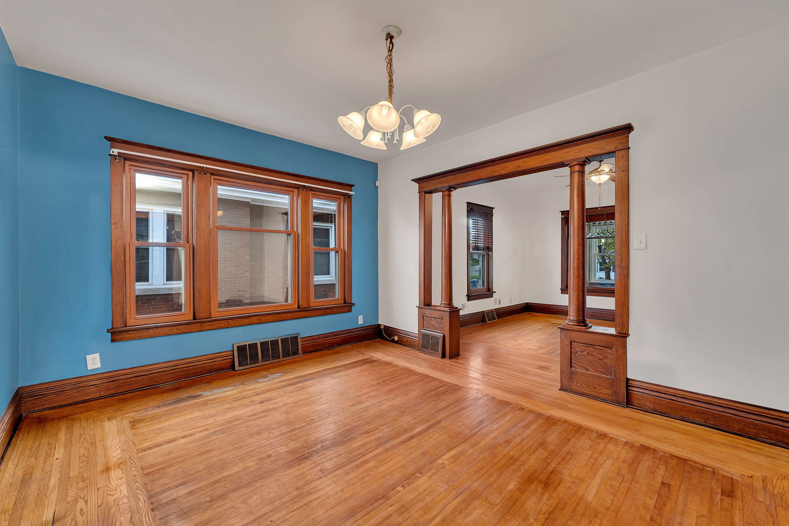 308 East Delaware Street Dwight, IL 60420 - Photo 10 of 29 a view of an empty room with window and wooden floor