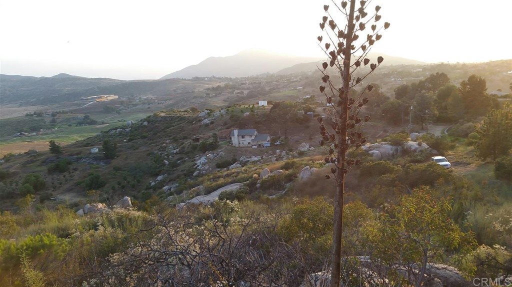 Hillside Estates Jamul, CA 91935 - Photo 16 of 24 a view of a mountain range with trees in the background