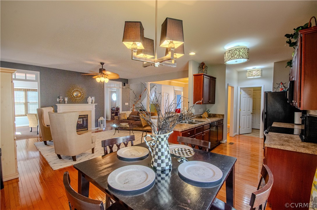 1113 Alcorn Terrace Midlothian, VA 23114 - Photo 13 of 36 a view of a dining room with furniture and wooden floor