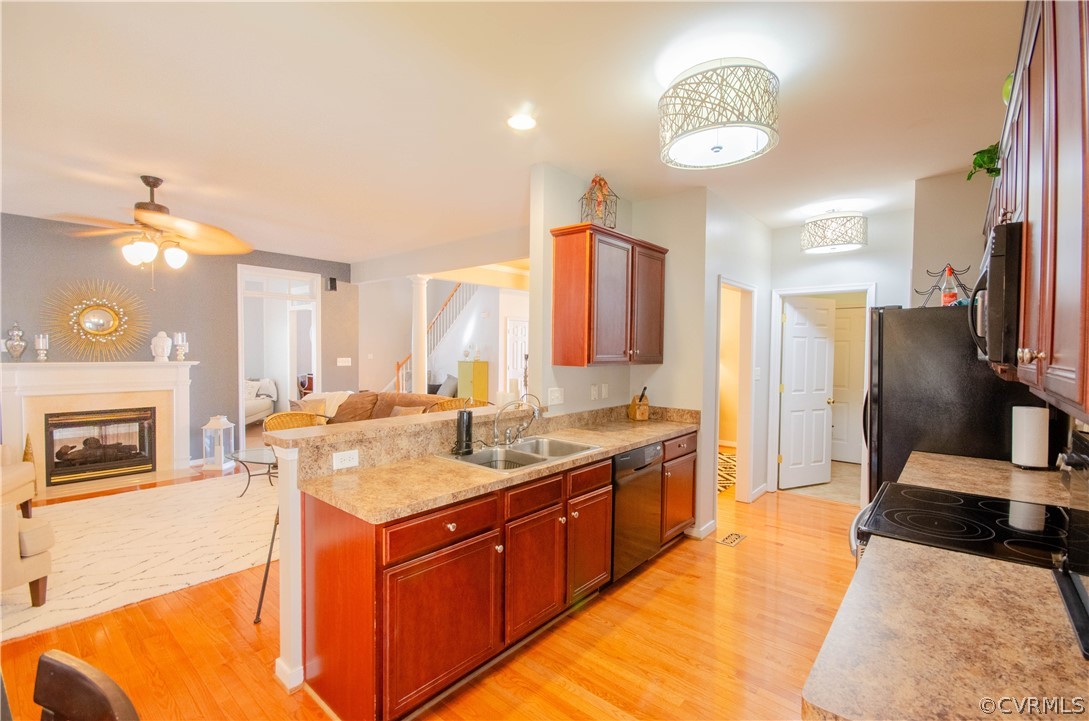 1113 Alcorn Terrace Midlothian, VA 23114 - Photo 14 of 36 a kitchen with stainless steel appliances granite countertop a sink stove and refrigerator