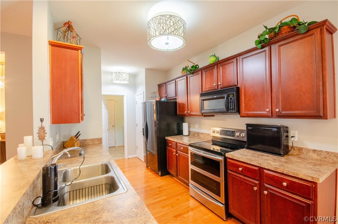 1113 Alcorn Terrace Midlothian, VA 23114 - Photo 15 of 36 a kitchen with stainless steel appliances granite countertop a sink stove and refrigerator