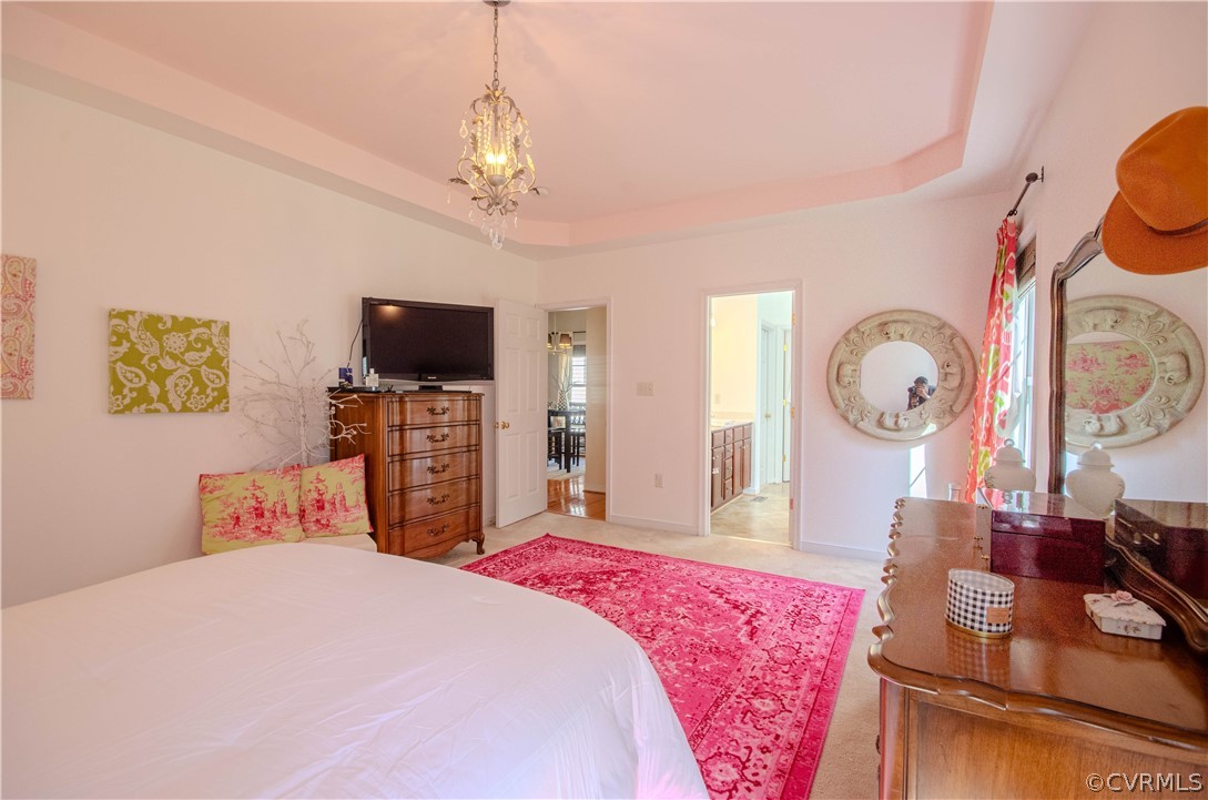 1113 Alcorn Terrace Midlothian, VA 23114 - Photo 25 of 36 a bedroom with a bed and a flat tv screen on dresser