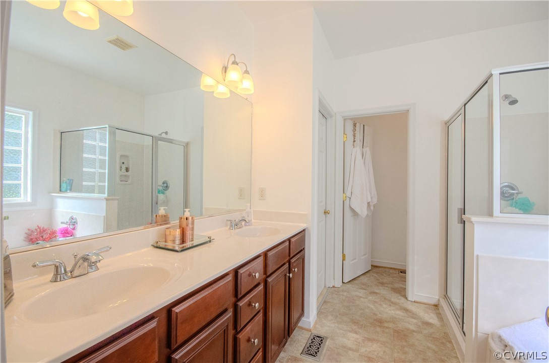 1113 Alcorn Terrace Midlothian, VA 23114 - Photo 26 of 36 a bathroom with a sink and a mirror