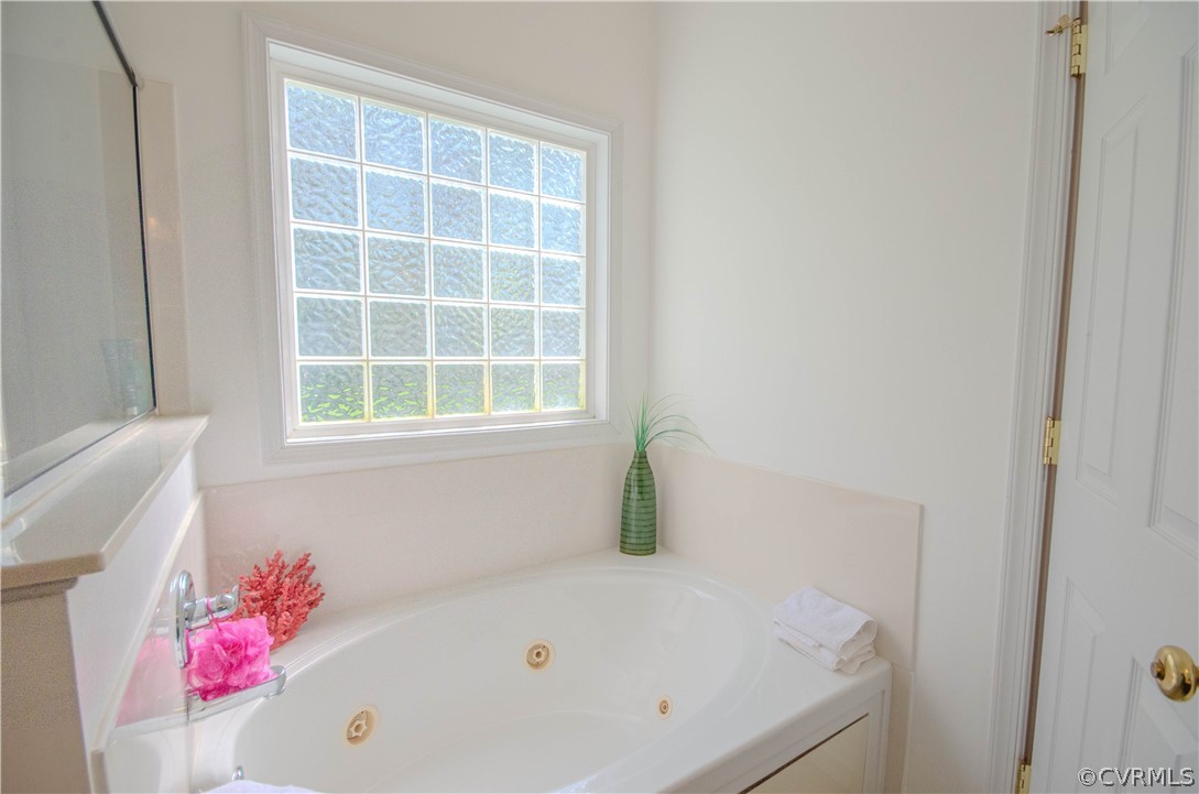 1113 Alcorn Terrace Midlothian, VA 23114 - Photo 28 of 36 a bathroom with a tub and a window