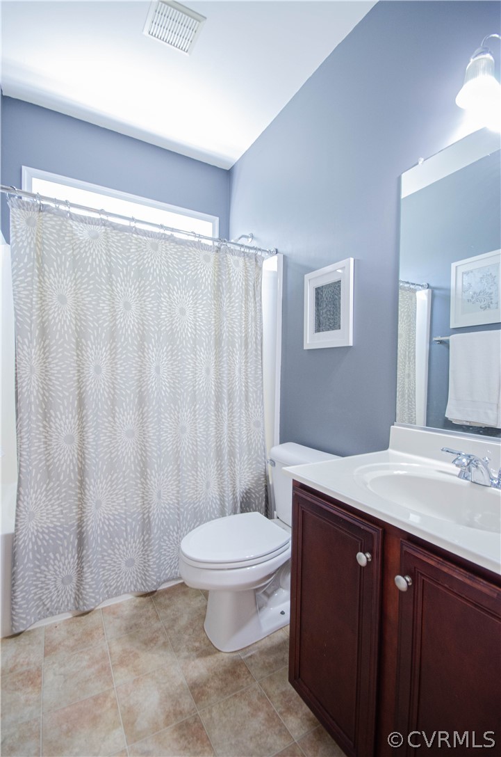 1113 Alcorn Terrace Midlothian, VA 23114 - Photo 31 of 36 a bathroom with a granite countertop sink toilet and a mirror