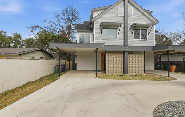 a front view of a house with a garage