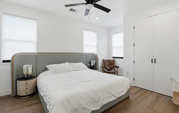 a bedroom with a bed and window