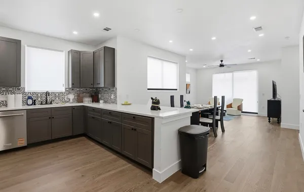 a large kitchen with lots of counter space and a sink