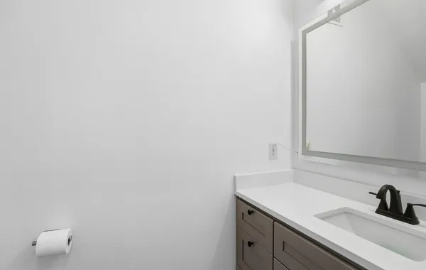 a bathroom with a sink and vanity
