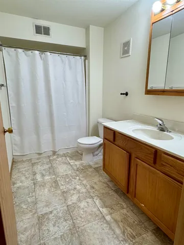 a view of balcony with wooden floor