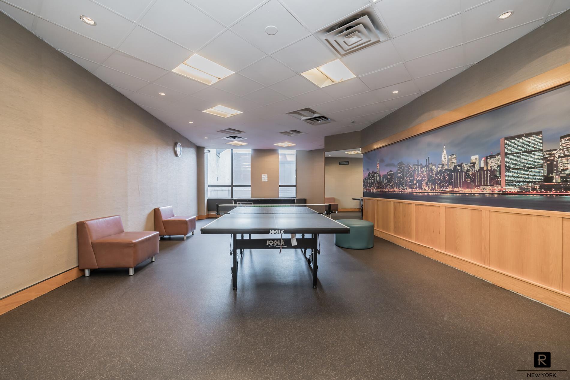 415 East 37th Street, Unit 27D Manhattan, NY 10016 - Photo 15 of 17 a lobby with furniture and window