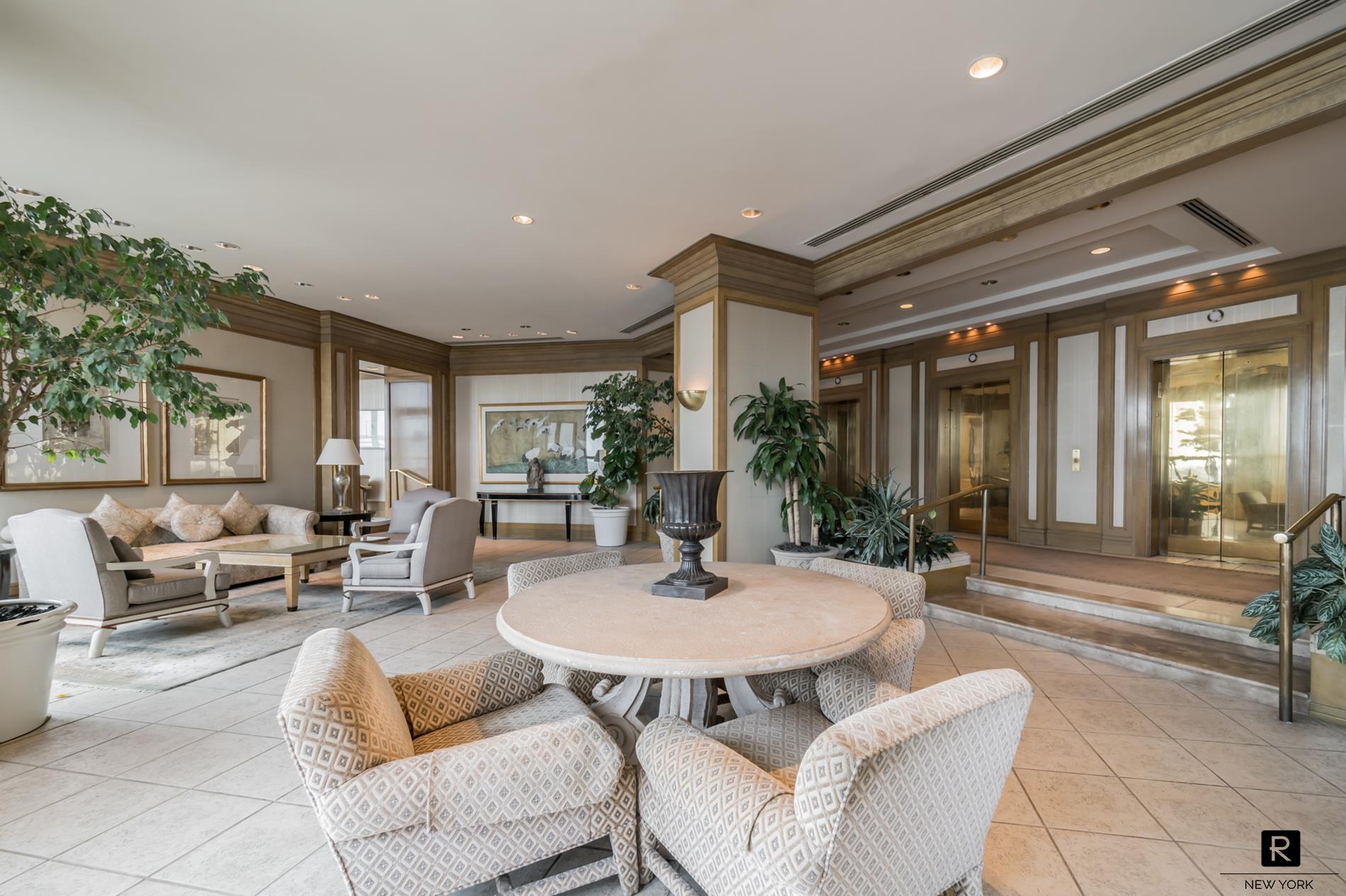415 East 37th Street, Unit 27D Manhattan, NY 10016 - Photo 17 of 17 a living room with furniture and a table