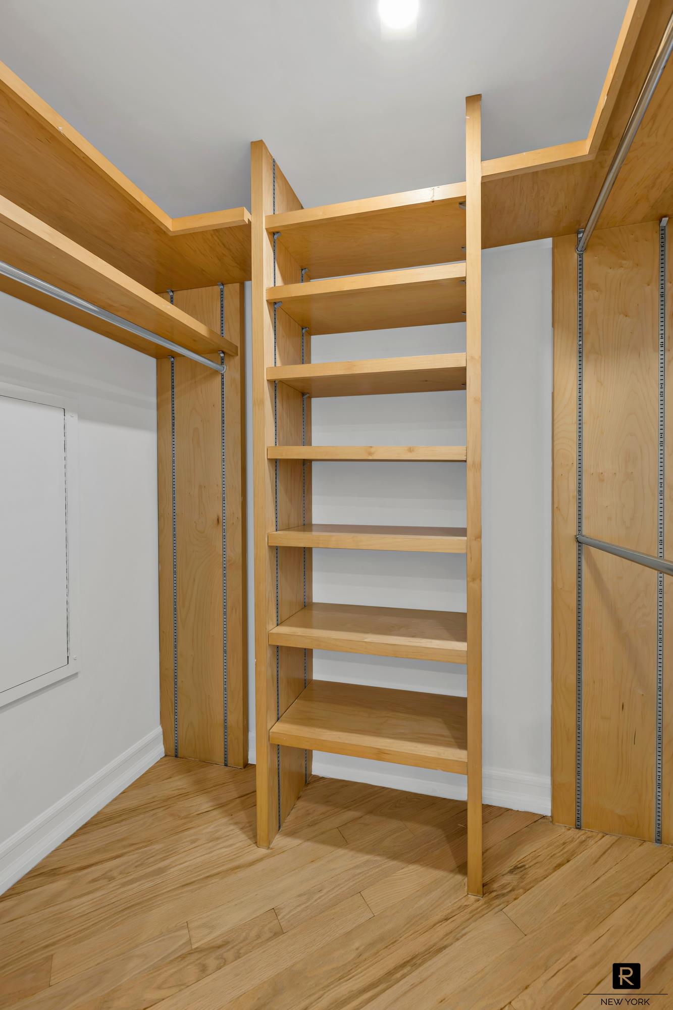 415 East 37th Street, Unit 27D Manhattan, NY 10016 - Photo 4 of 17 a view of walk in closet with empty racks