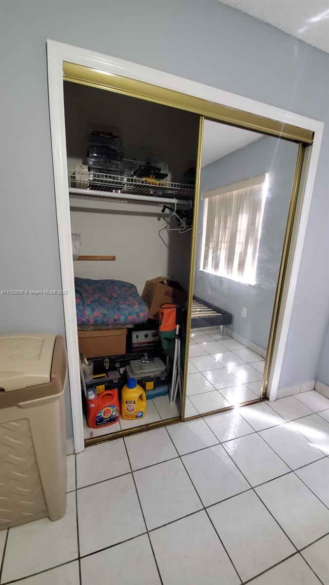 5830 West 18th Lane, Unit 101 Hialeah, FL 33012 - Photo 13 of 14 a room with washing machine