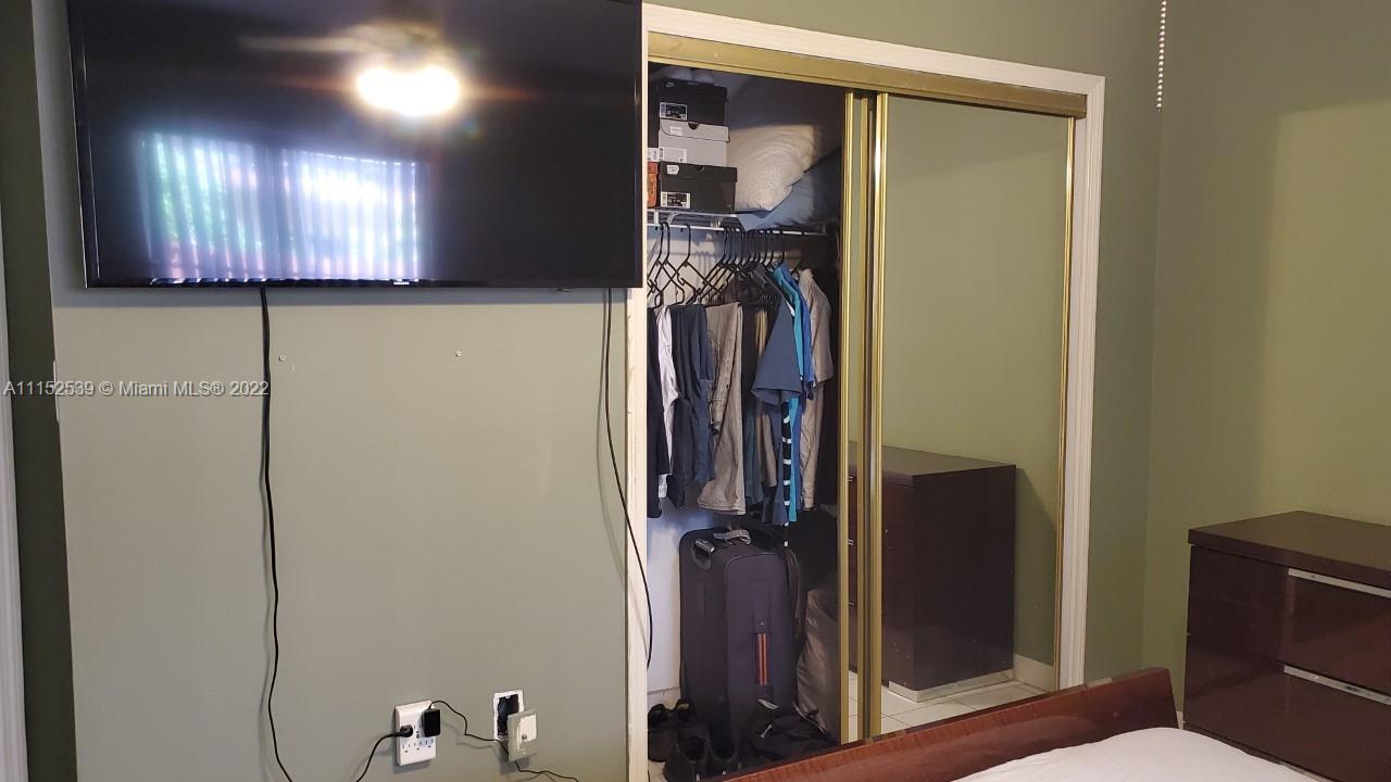 5830 West 18th Lane, Unit 101 Hialeah, FL 33012 - Photo 9 of 14 a view of a hallway with elevator