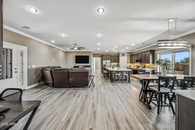 a kitchen with granite countertop a stove a sink and a microwave