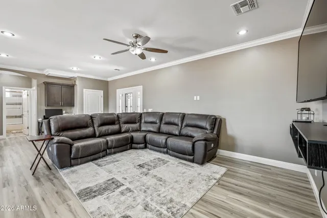 a large kitchen with a table and chairs