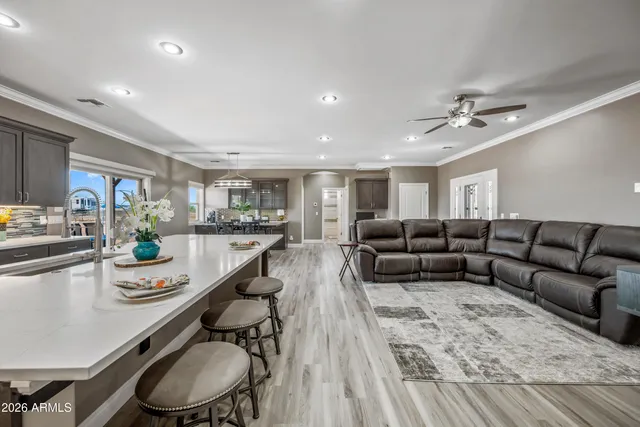 a kitchen with stainless steel appliances granite countertop a sink a stove and a microwave