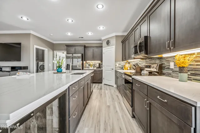 a view of a dining room with furniture wooden floor and chandelier