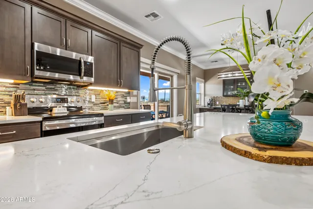 a en suite bathroom with a sink and a mirror