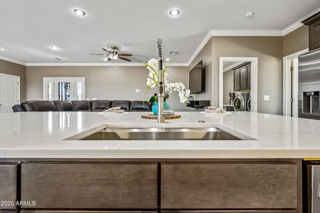 a bedroom that has a bed and a large mirror