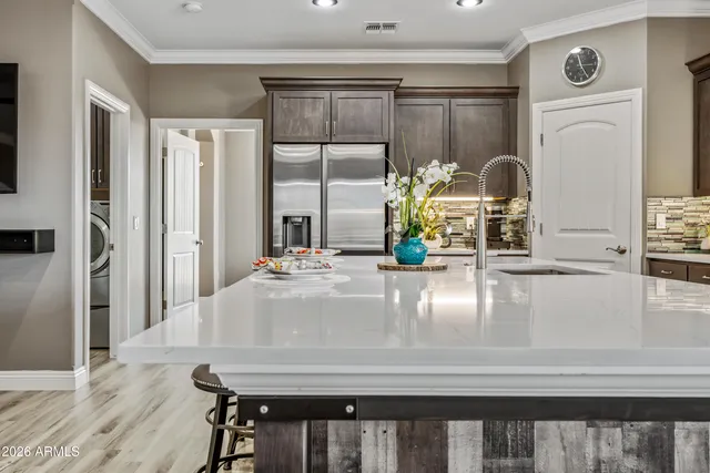a spacious bathroom with a shower sink and mirror