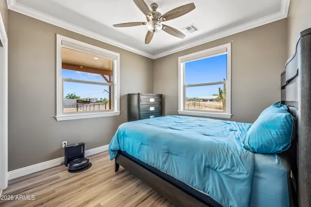 a bathroom with a granite countertop sink a mirror and a shower