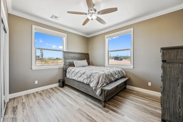 a view of walk in closet with clothes
