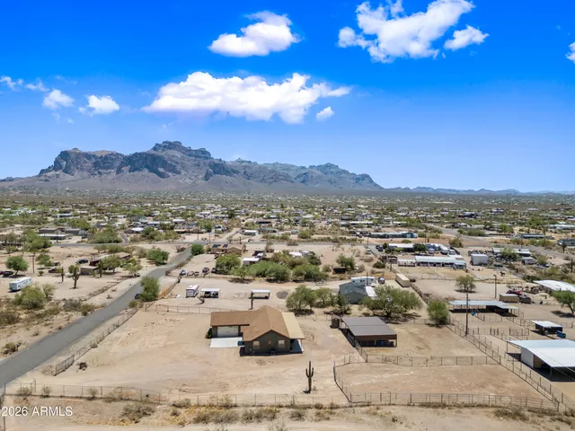 a view of a house with a yard and a garage