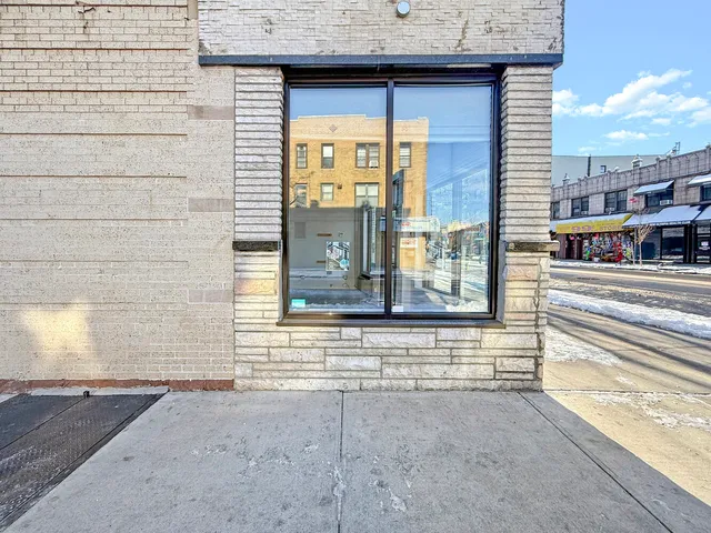 a view of a brick house with a street