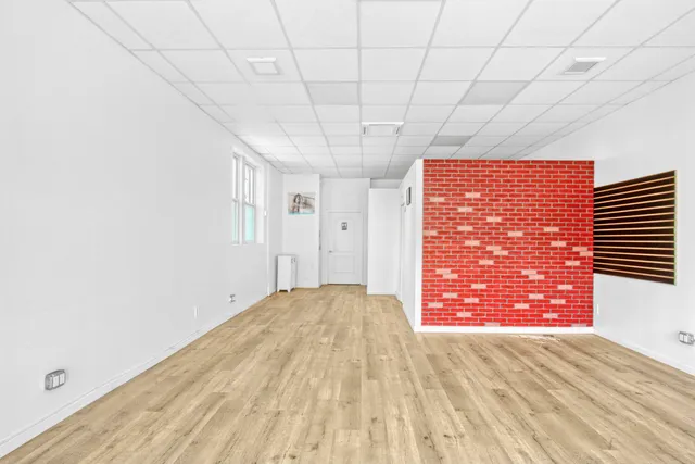 a view of empty room with floor to ceiling window