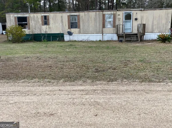 a view of a backyard with potted plants