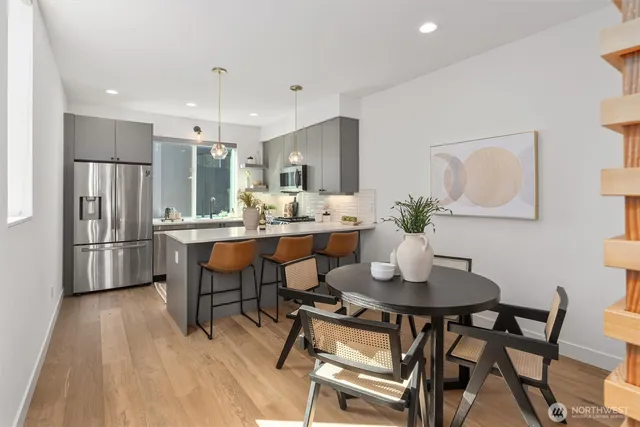 a dining room with furniture and window