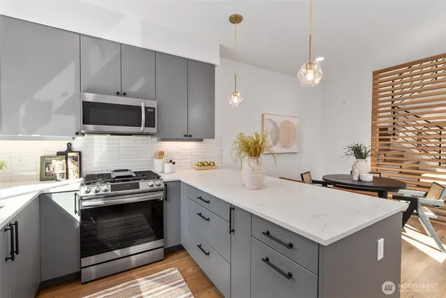 a kitchen with a stove and a sink