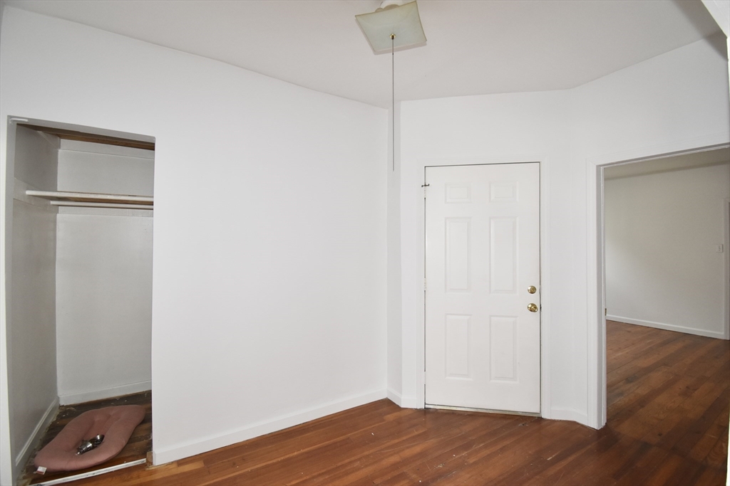 86 Cochran Street, Unit 3 Chicopee, MA 01020 - Photo 7 of 18 a view of an empty room with wooden floor