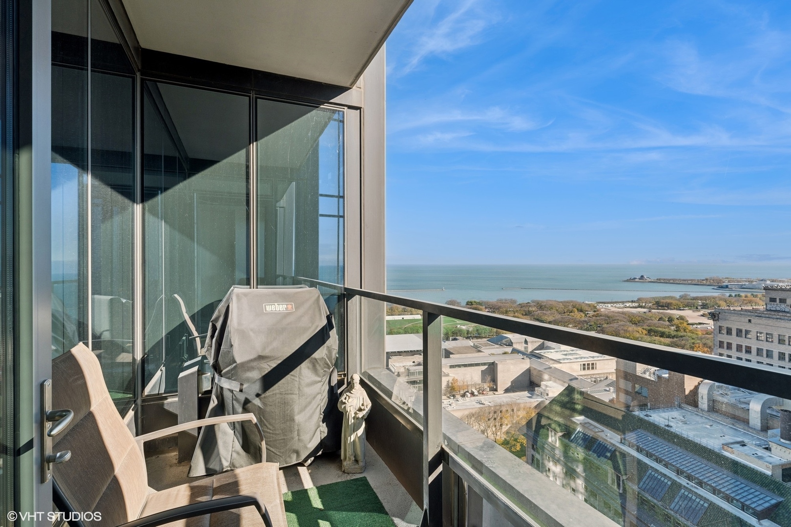 60 East Monroe Street, Unit 2903 Chicago, IL 60603 - Photo 12 of 19 a view of a chair and table in the balcony