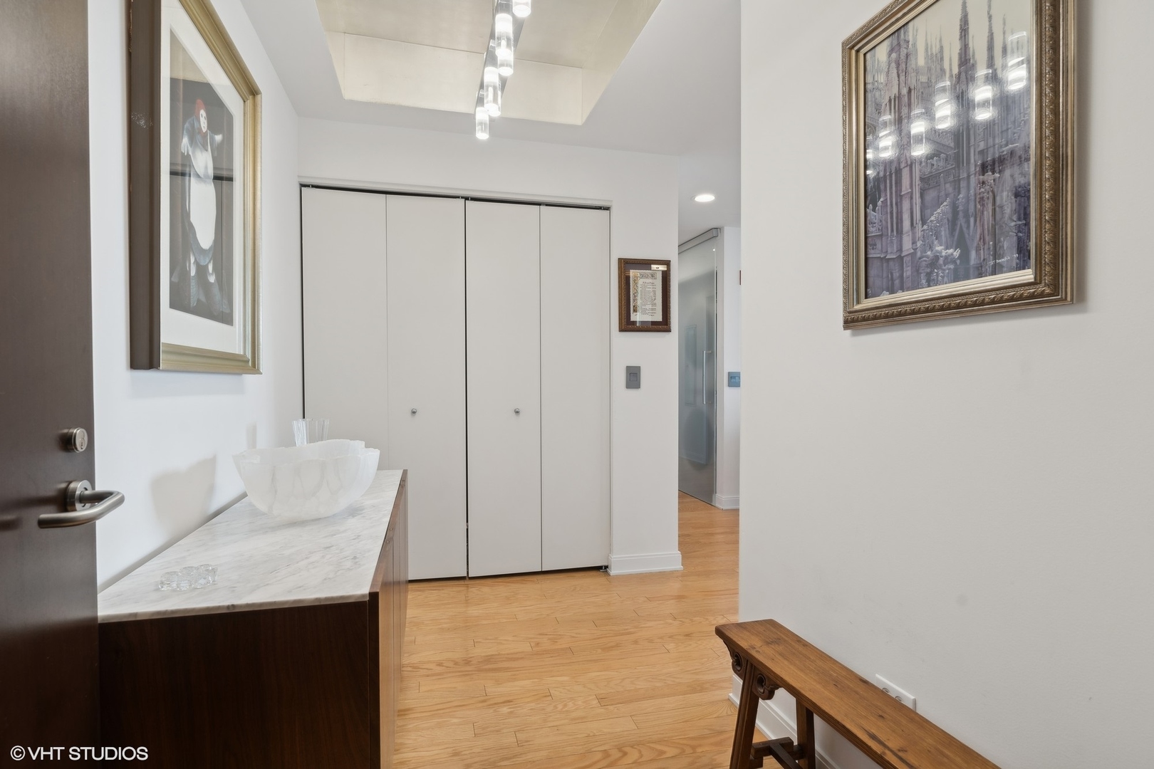 60 East Monroe Street, Unit 2903 Chicago, IL 60603 - Photo 2 of 19 a bathroom with a sink and a mirror
