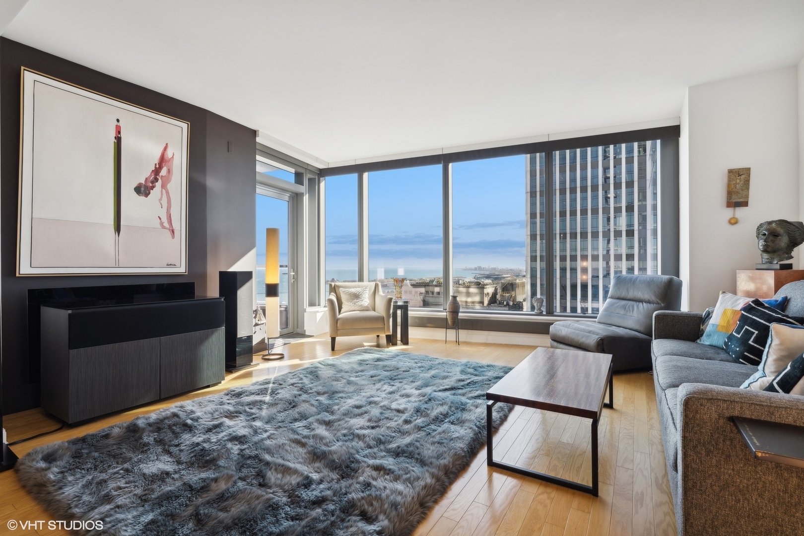 60 East Monroe Street, Unit 2903 Chicago, IL 60603 - Photo 3 of 19 a living room with furniture large window and rug