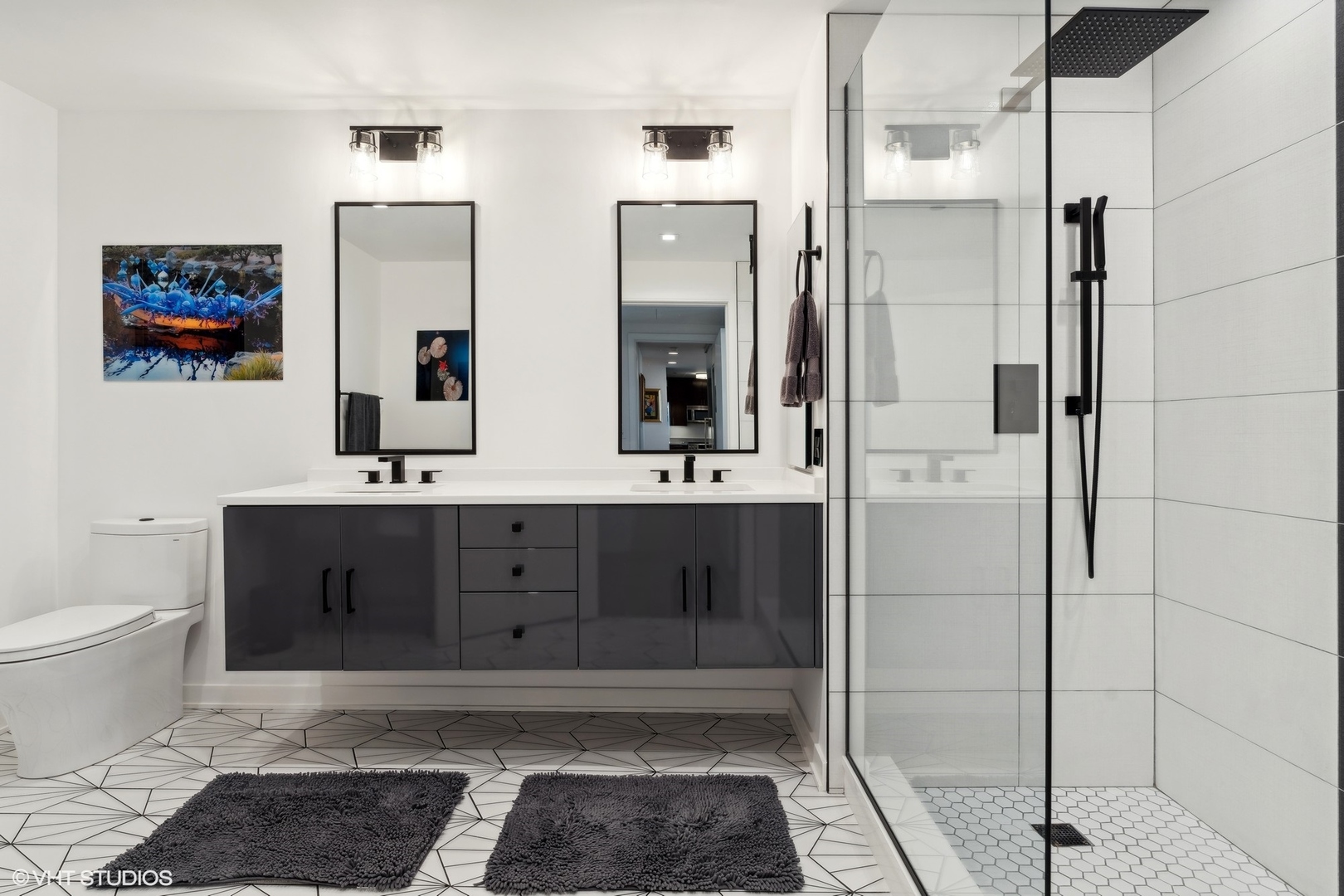 60 East Monroe Street, Unit 2903 Chicago, IL 60603 - Photo 7 of 19 a bathroom with a sink and a mirror